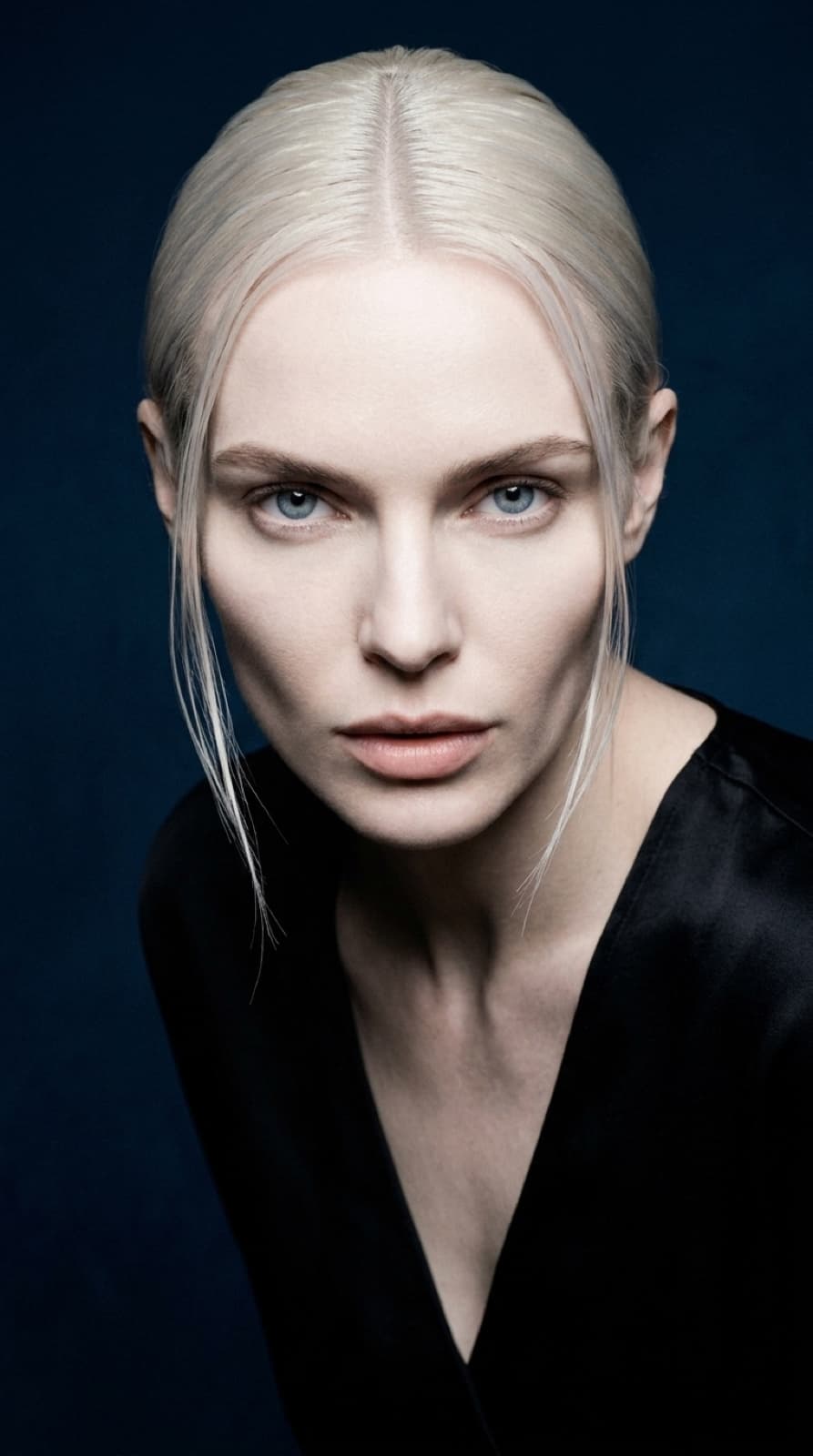 selene leaning forward to camera, intense direct gaze, black silk, midnight navy