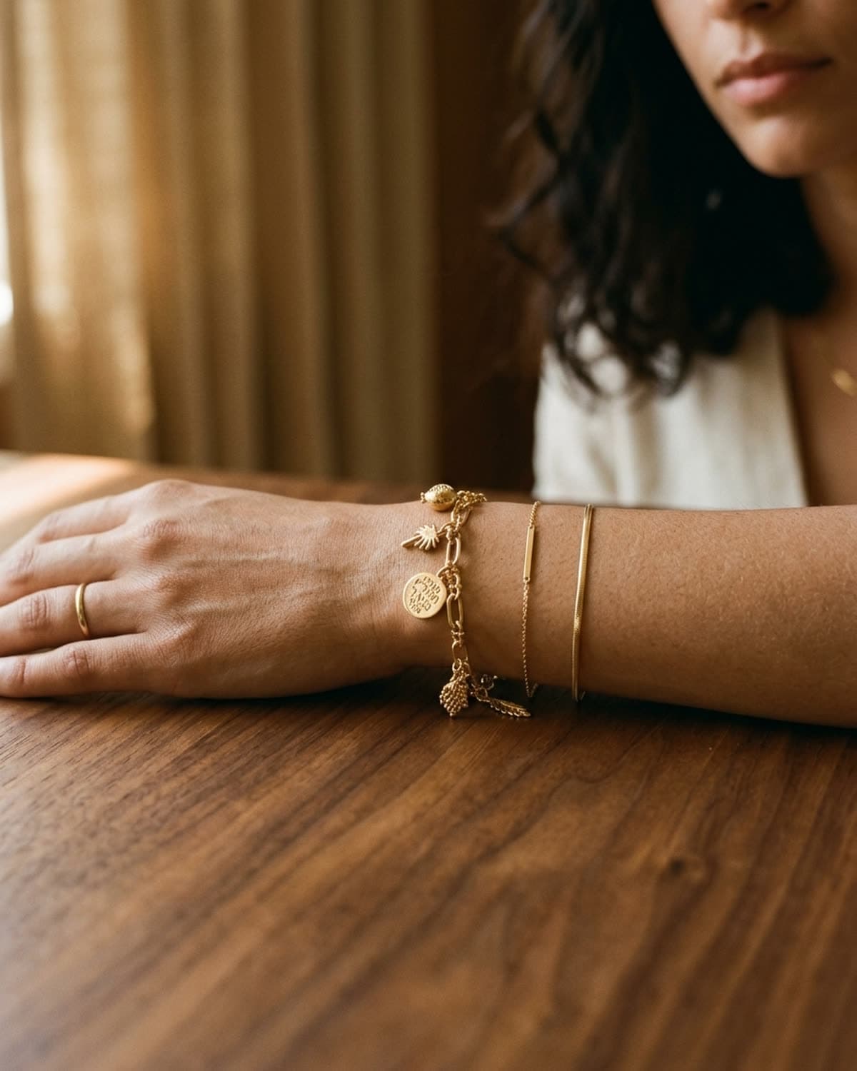 bracelet photographed with bling ai — stack on wrist, warm wood