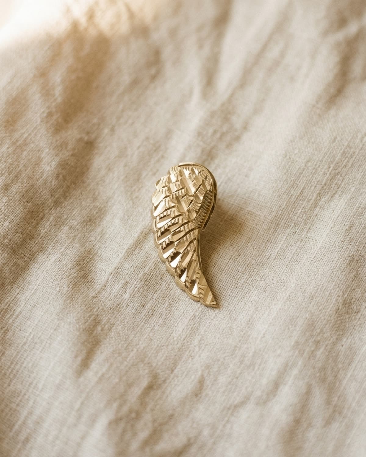 earring photographed with bling ai — overhead lay-flat on linen