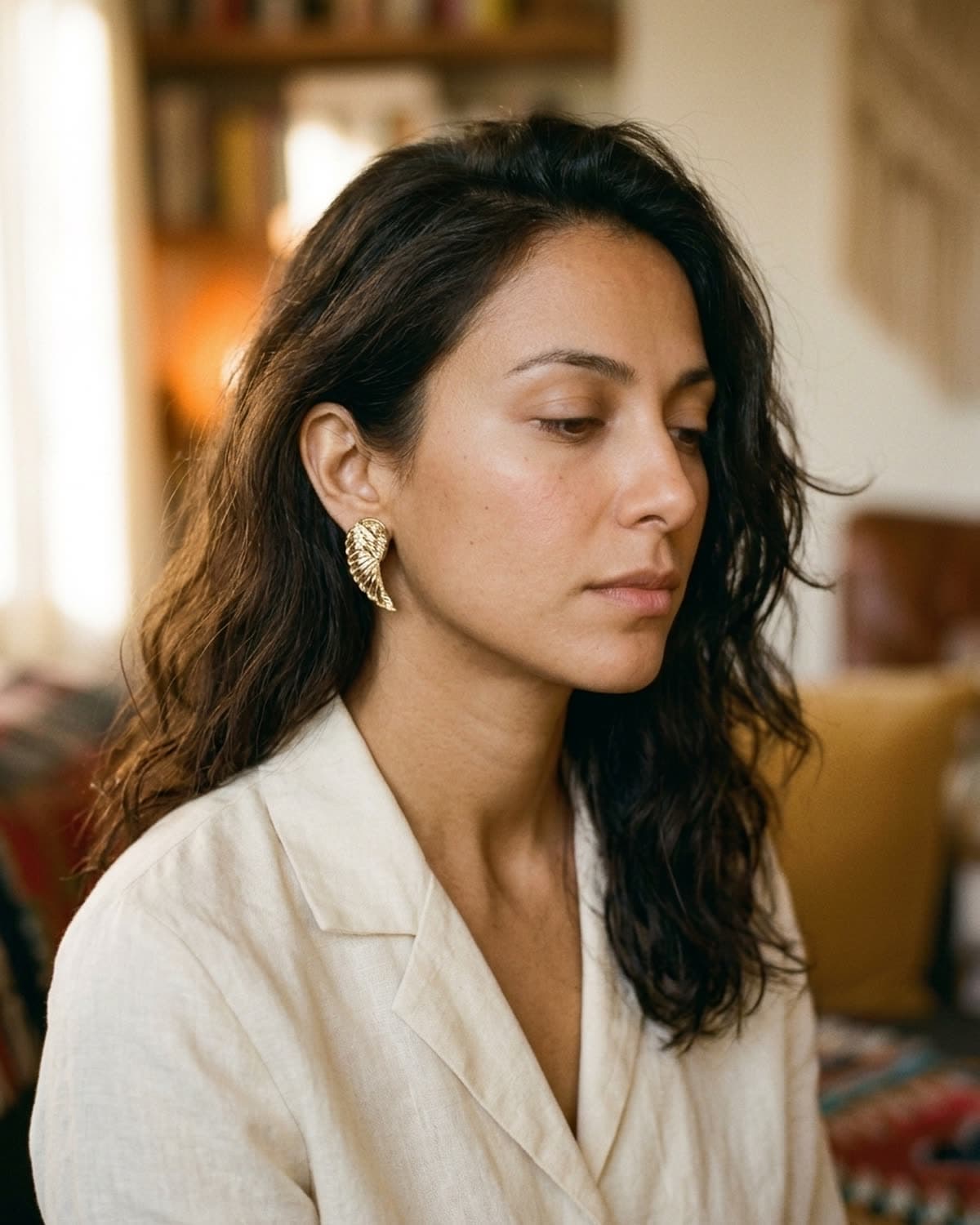 earring photographed with bling ai — three-quarter view, golden hour