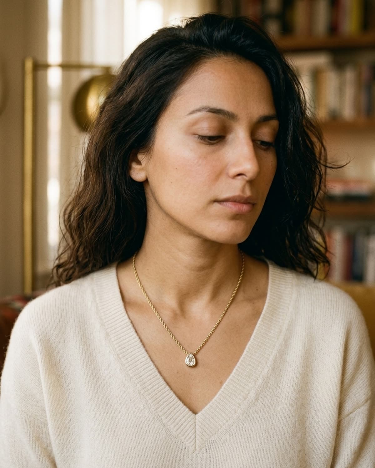 necklace photographed with bling ai — cream knit, three-quarter
