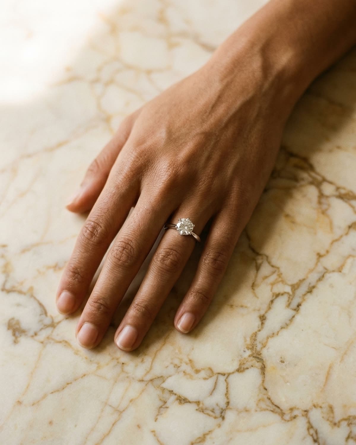 ring photographed with bling ai — warm marble overhead